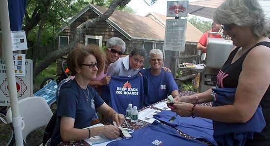firefighters Mary DiFede, Doreen Rallo, Francine Sardone & Joan VanNess sell Shirley Ritenour a CGFD shirt - photo by Bruce-Michael Gelbert
